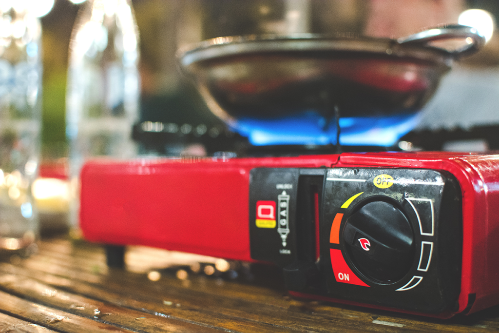 Portable gas stove Portable gas stove and a frying pan.